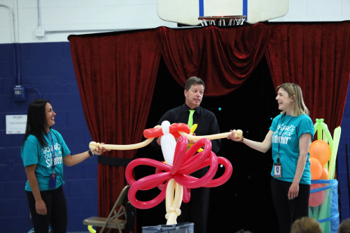 summer camp show Art of Inflation, Dale Obrochta with two staff volunteers